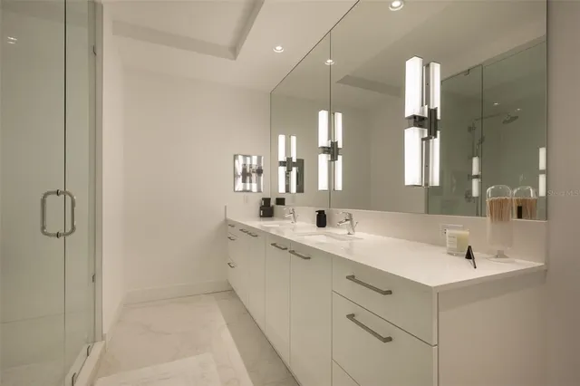 a spacious bedroom with a bed and a chair