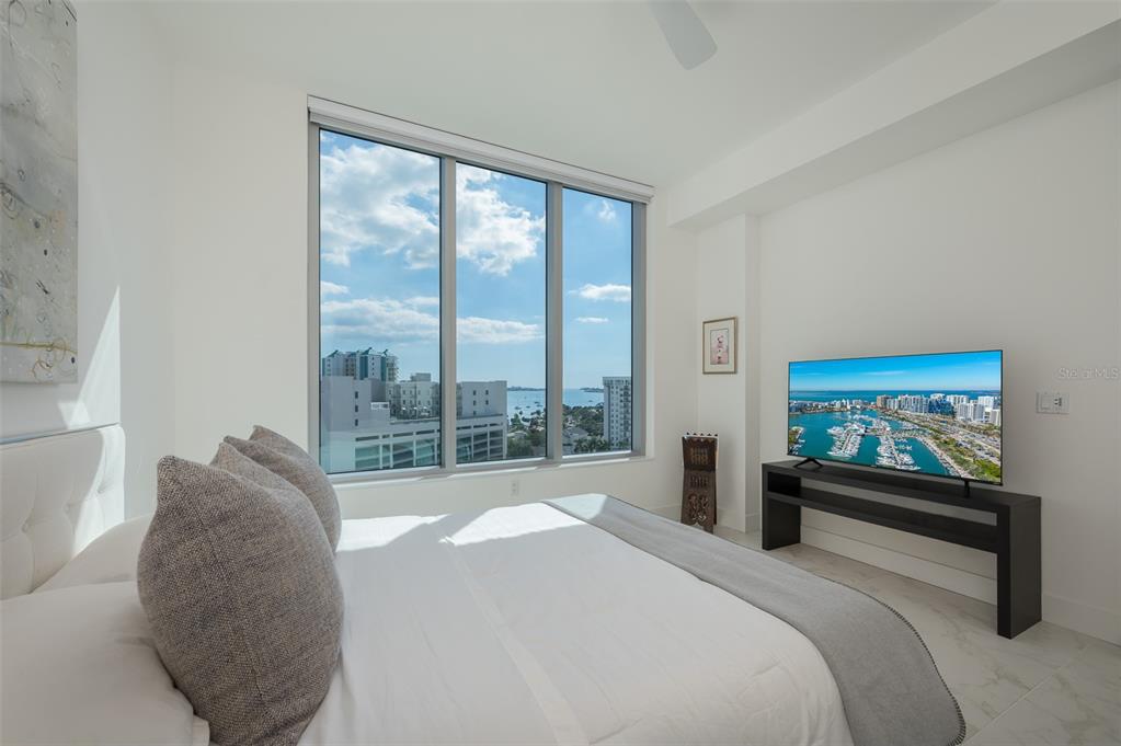 111 South Pineapple Avenue, Unit 1013 Sarasota, FL 34236 - Photo 22 of 62 a bedroom with a large bed and a large window