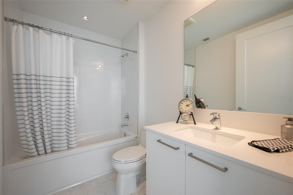 111 South Pineapple Avenue, Unit 1013 Sarasota, FL 34236 - Photo 24 of 62 a bathroom with a sink toilet and shower