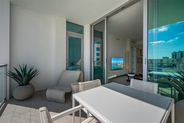 a view of a livingroom with furniture and a potted plant