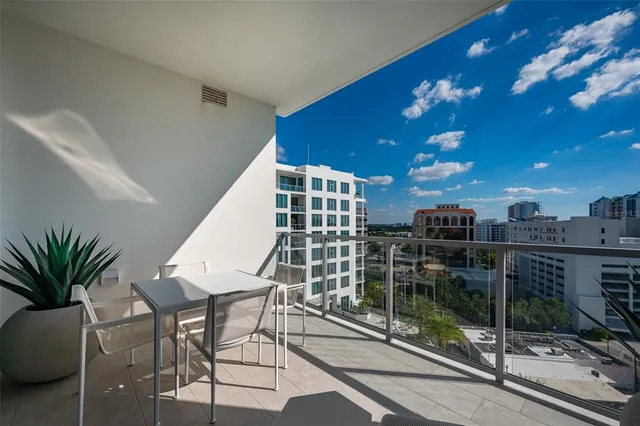 a view of swimming pool with outdoor seating and plants
