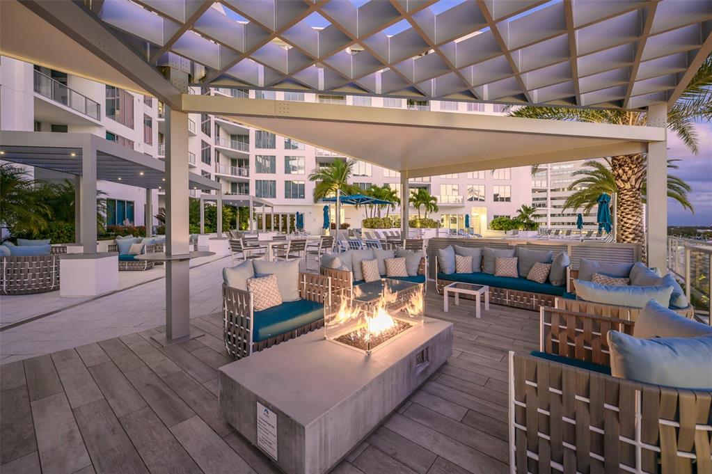 111 South Pineapple Avenue, Unit 1013 Sarasota, FL 34236 - Photo 39 of 62 a outdoor living space with patio furniture and a fireplace