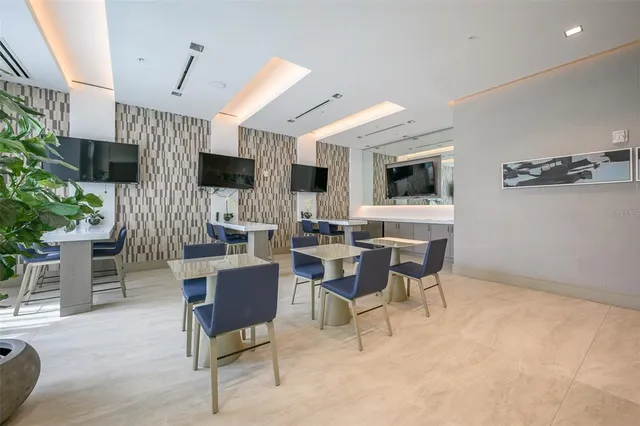 a view of a dining room with furniture and window