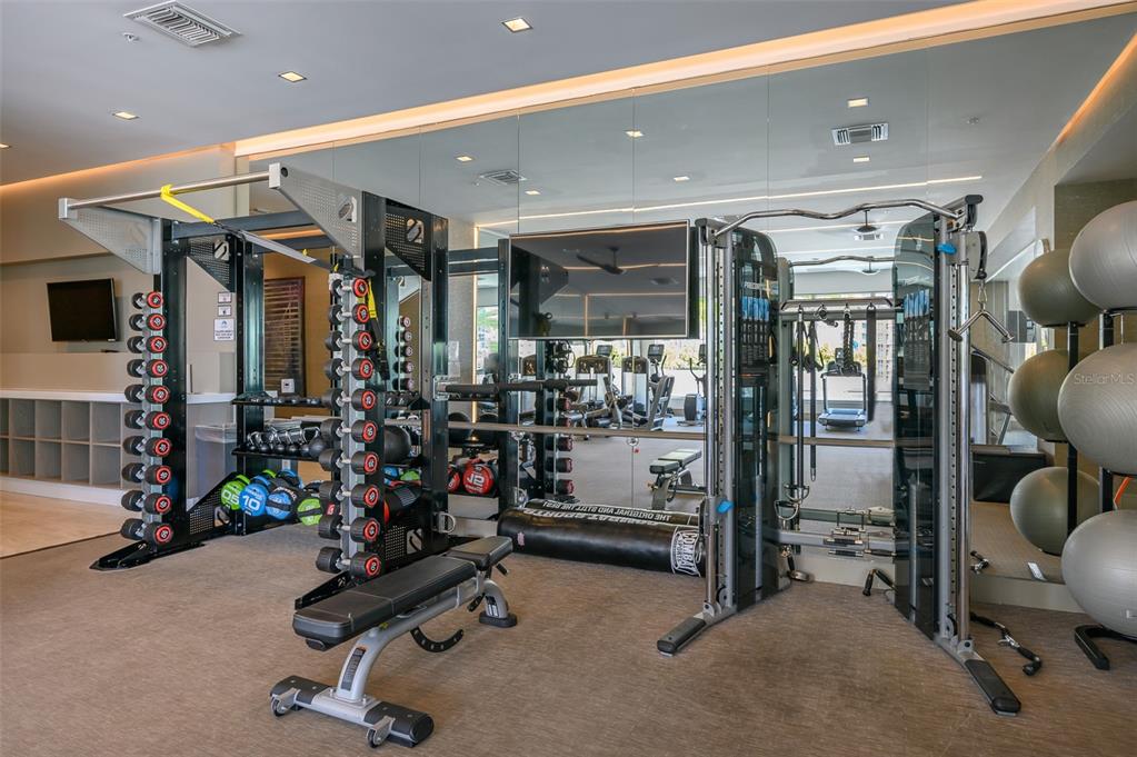 111 South Pineapple Avenue, Unit 1013 Sarasota, FL 34236 - Photo 44 of 62 a view of a room with gym equipment