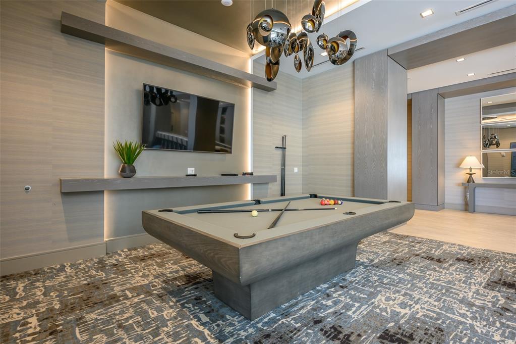 111 South Pineapple Avenue, Unit 1013 Sarasota, FL 34236 - Photo 45 of 62 a spacious bathroom with a granite countertop sink and a mirror