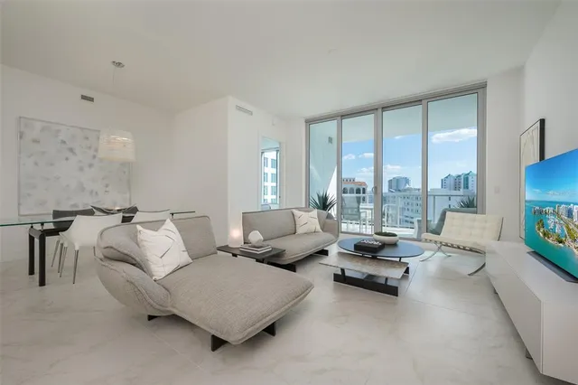 a kitchen with stainless steel appliances a sink stove and refrigerator