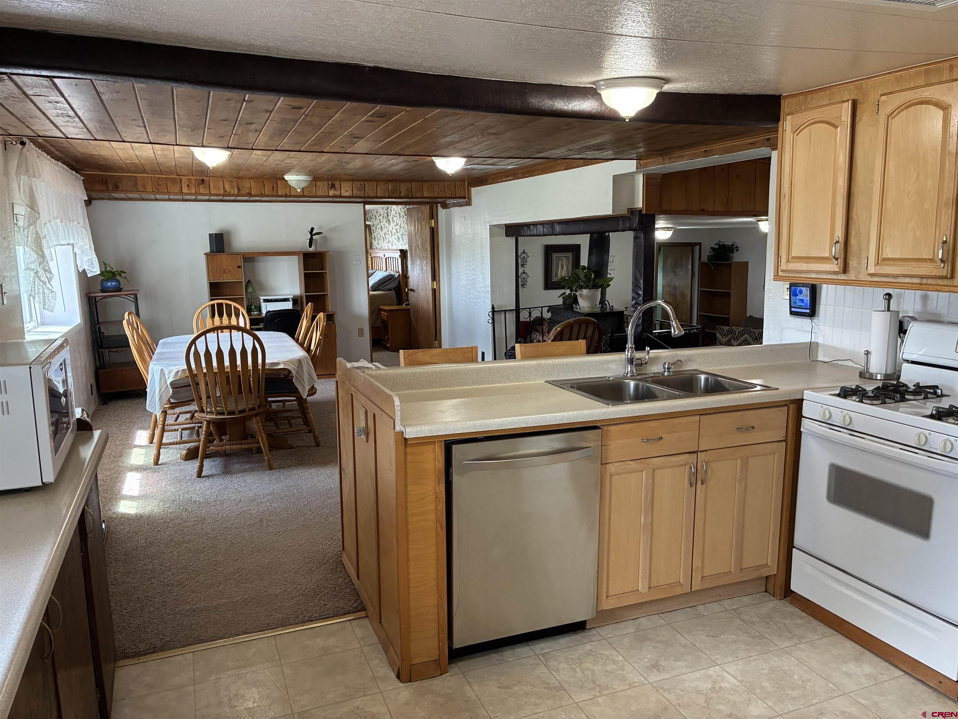 20806 County Road West Sanford, CO 81151 - Photo 16 of 24 a kitchen with sink and white cabinets