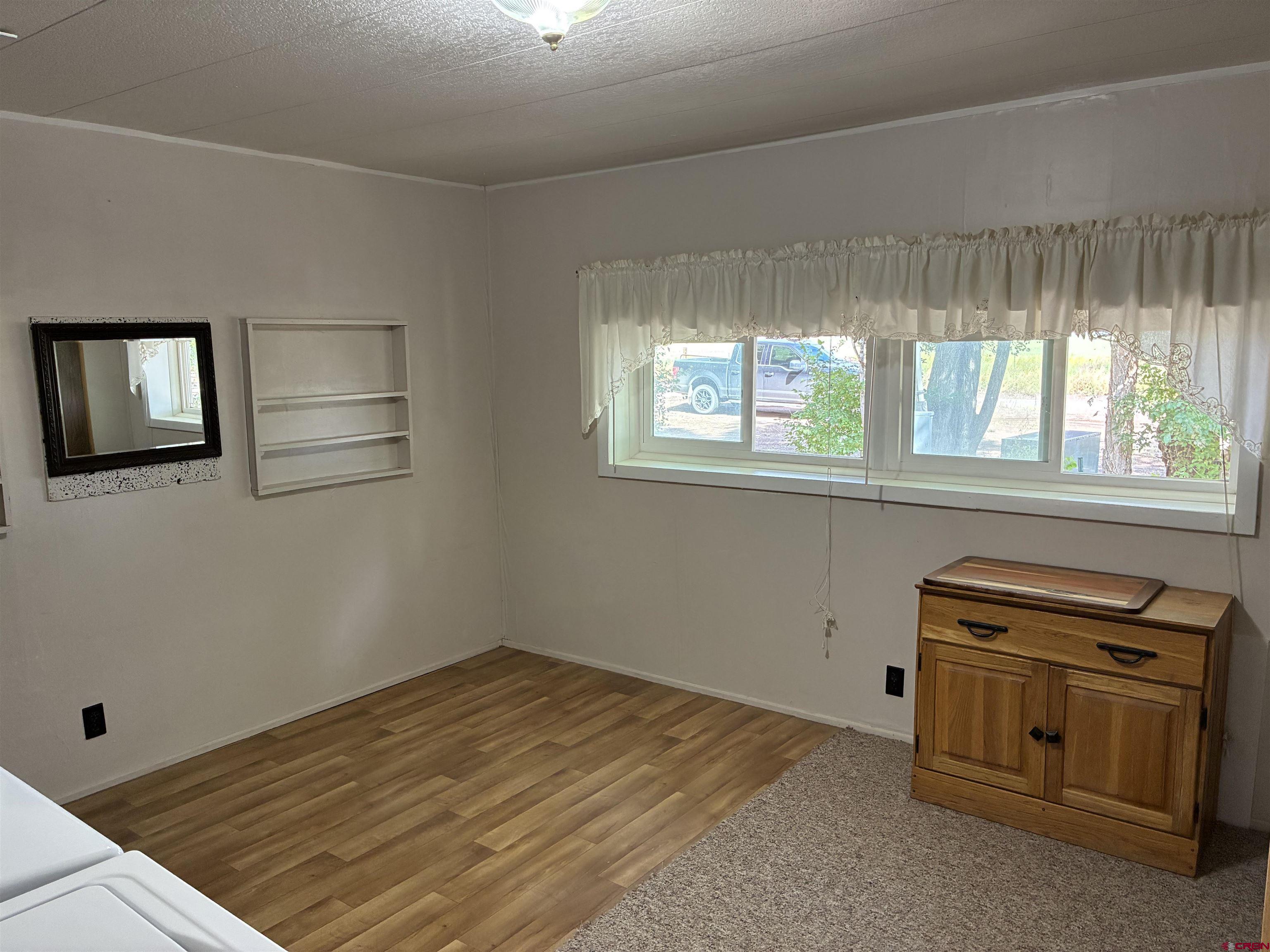 20806 County Road West Sanford, CO 81151 - Photo 18 of 24 an empty room with windows and closet