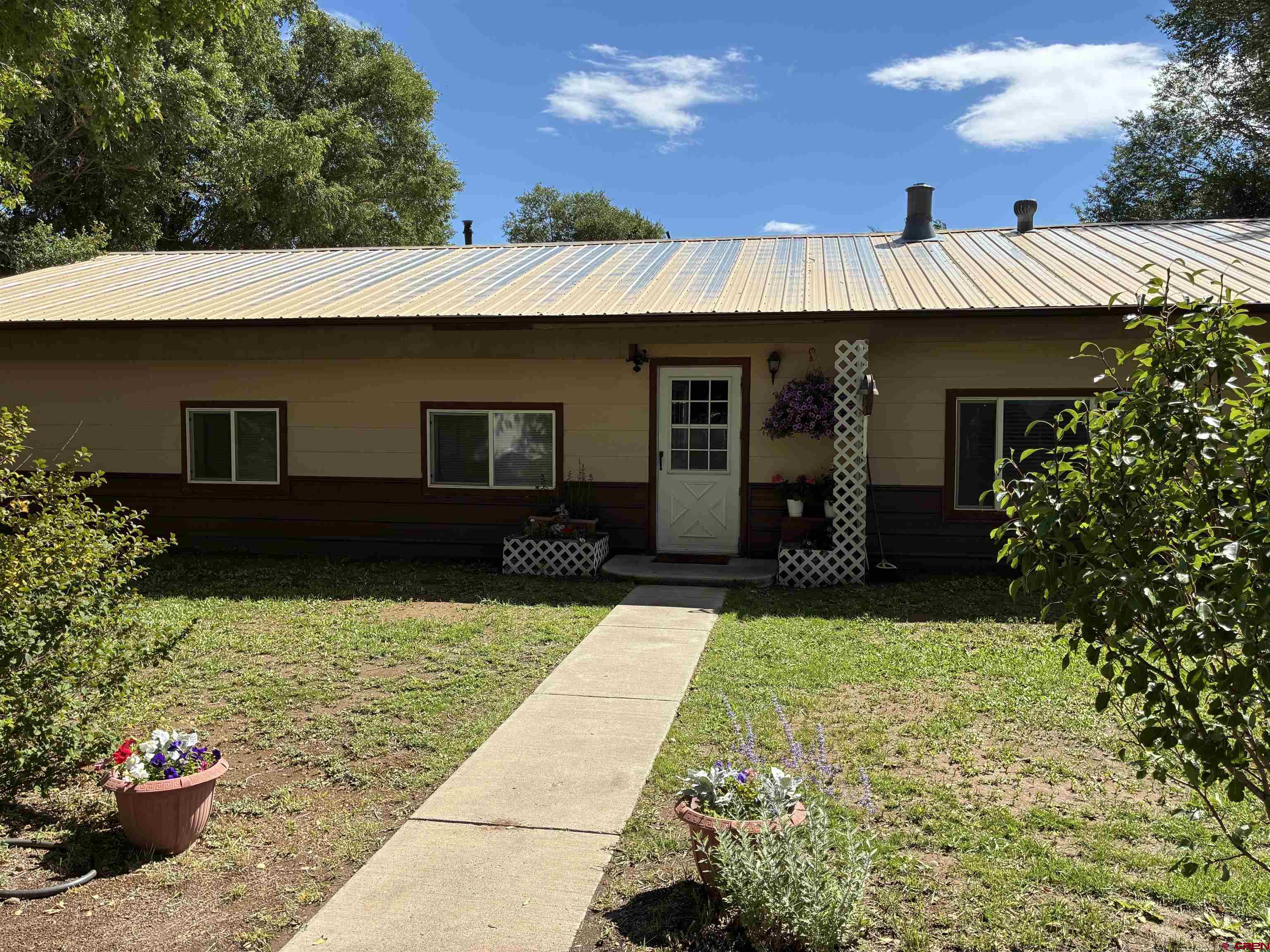20806 County Road West Sanford, CO 81151 - Photo 3 of 24 a view of a house with potted plants