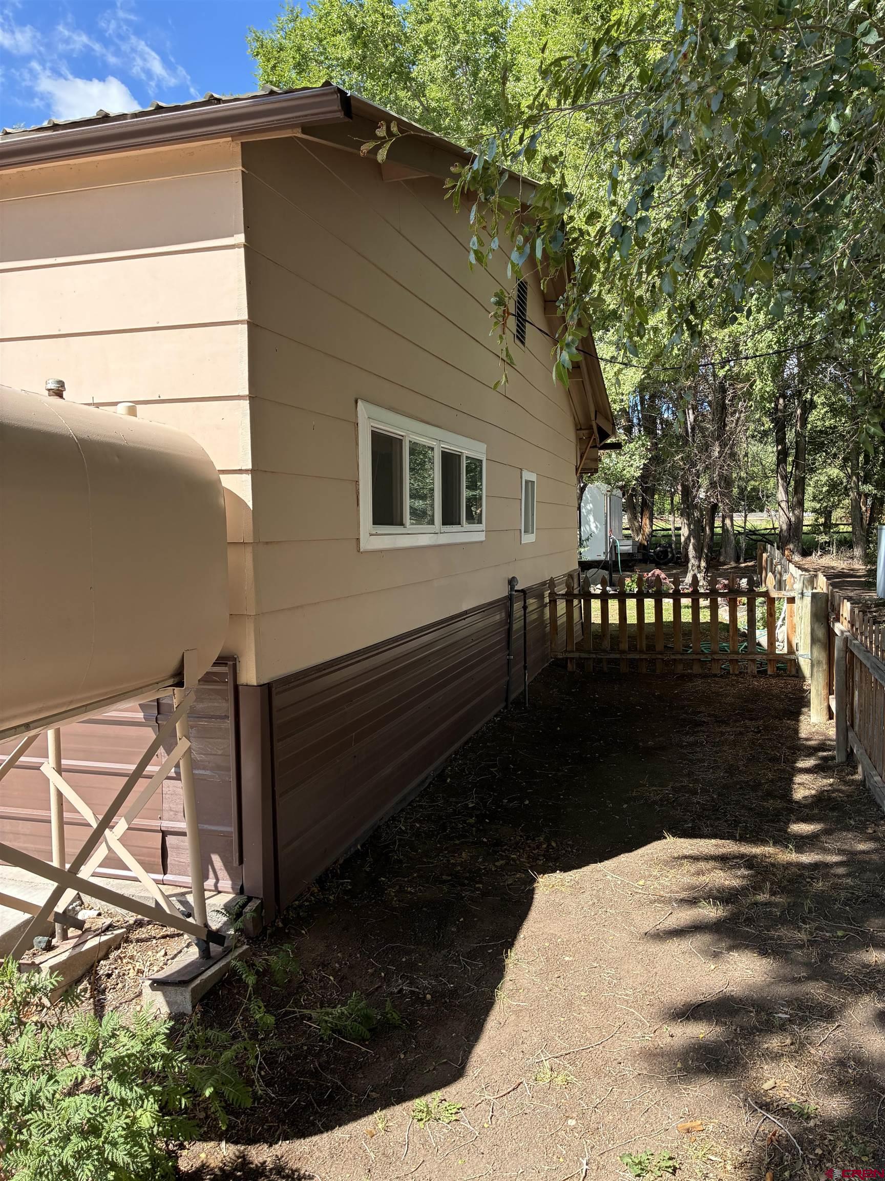 20806 County Road West Sanford, CO 81151 - Photo 4 of 24 a view of a house with a yard
