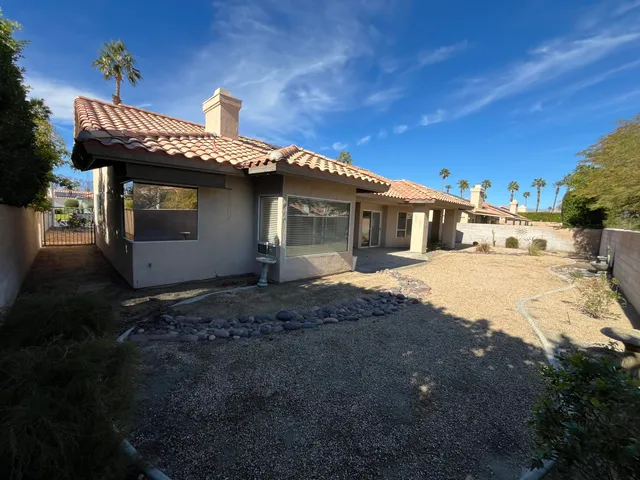 a view of a house with roof yard