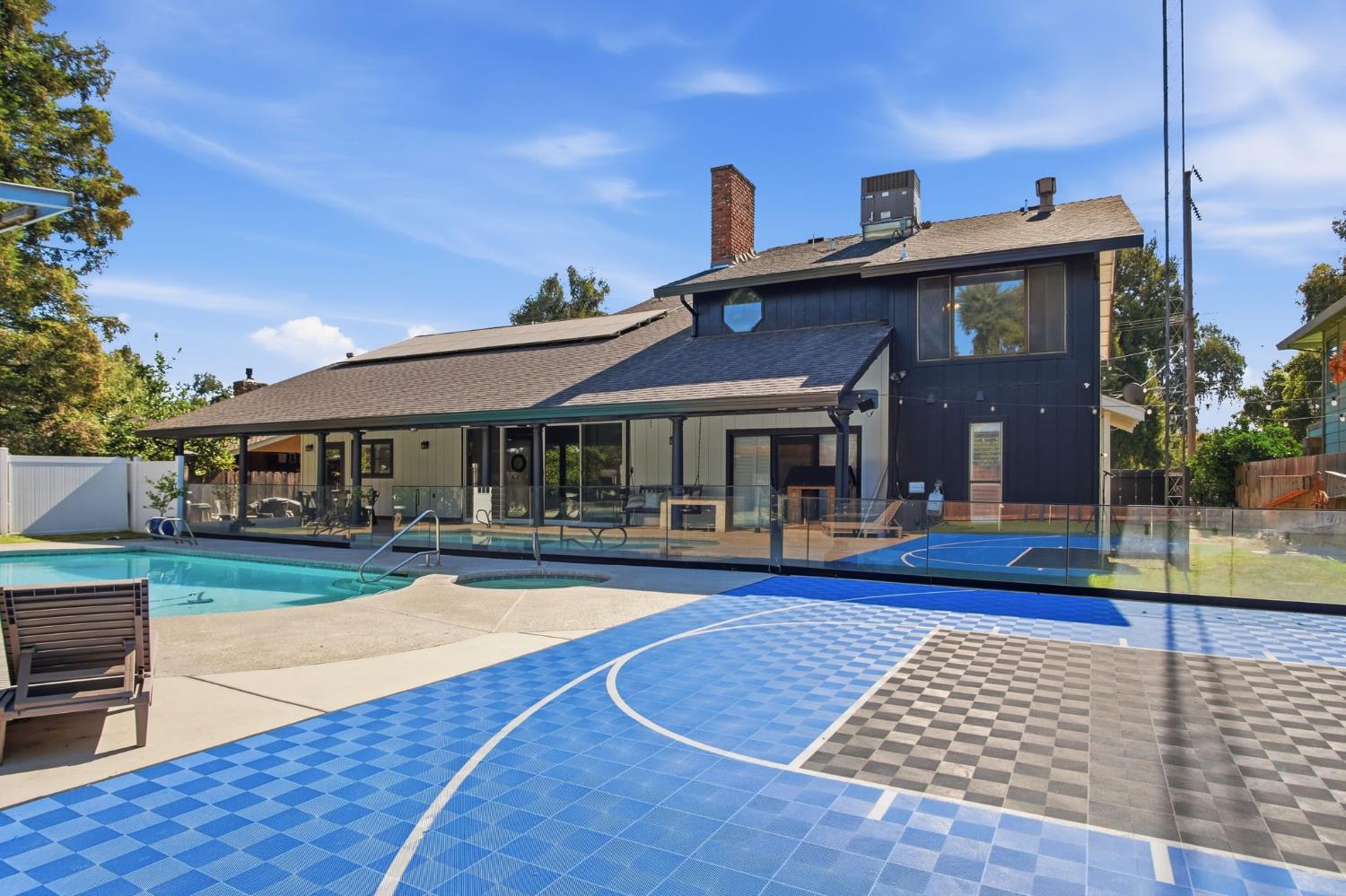 10401 Golf Link Road Turlock, CA 95380 - Photo 49 of 63 a view of house with yard outdoor seating and kitchen