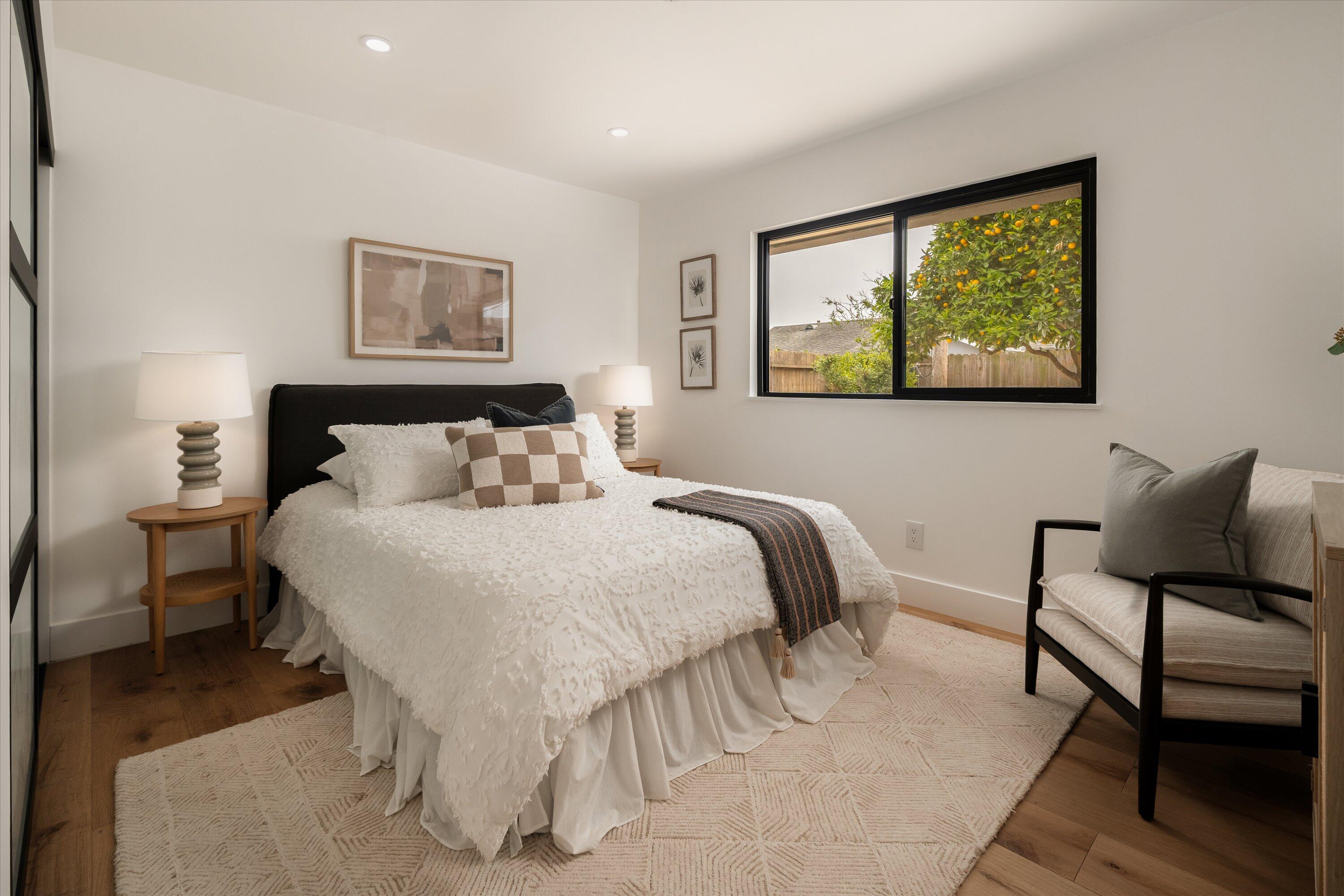 674 Burtis Street Santa Barbara, CA 93111 - Photo 14 of 29 a bedroom with a bed and painting on the wall