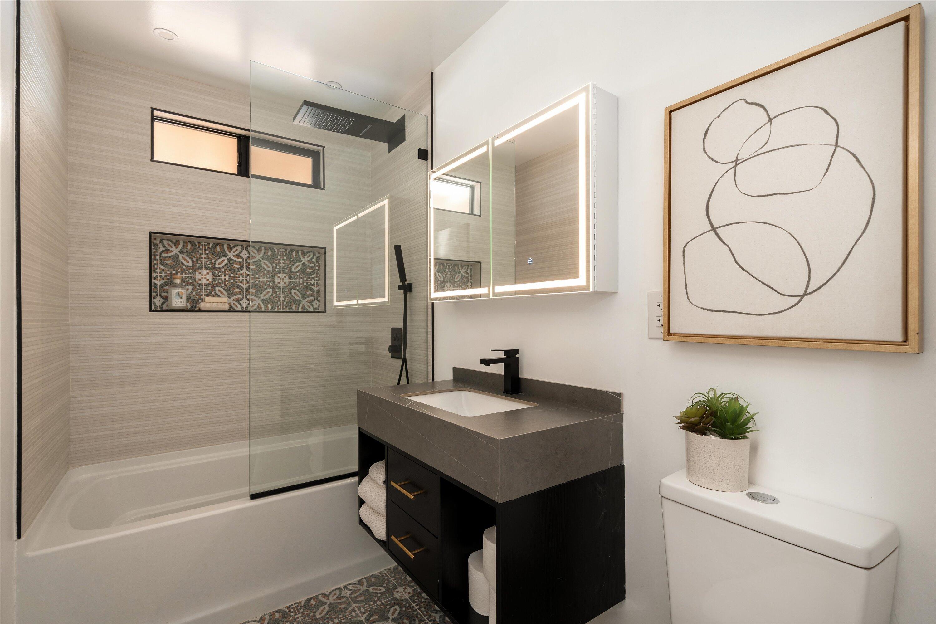 674 Burtis Street Santa Barbara, CA 93111 - Photo 15 of 29 a bathroom with a sink a toilet and a bathtub