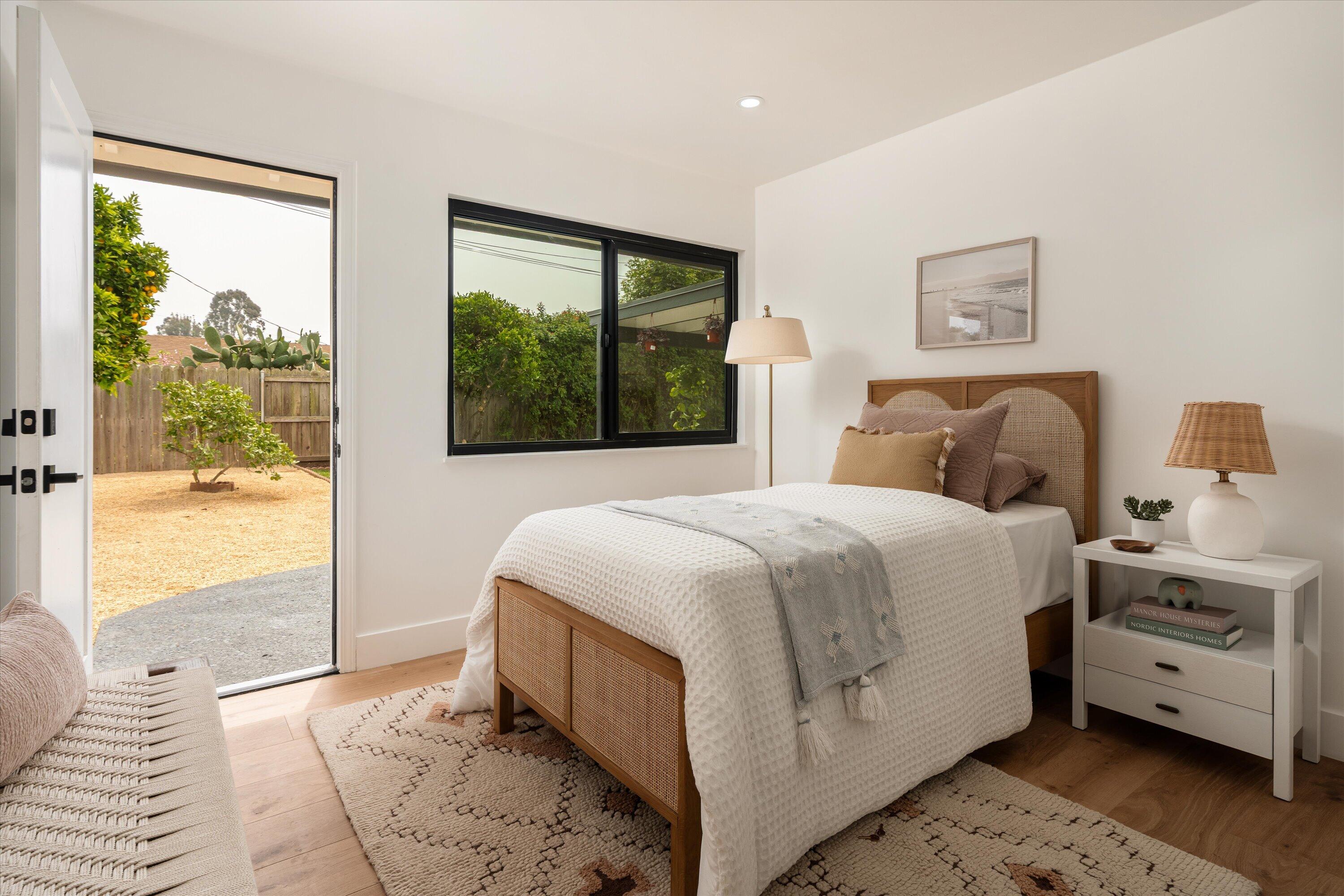 674 Burtis Street Santa Barbara, CA 93111 - Photo 16 of 29 a bedroom with a bed and a large window