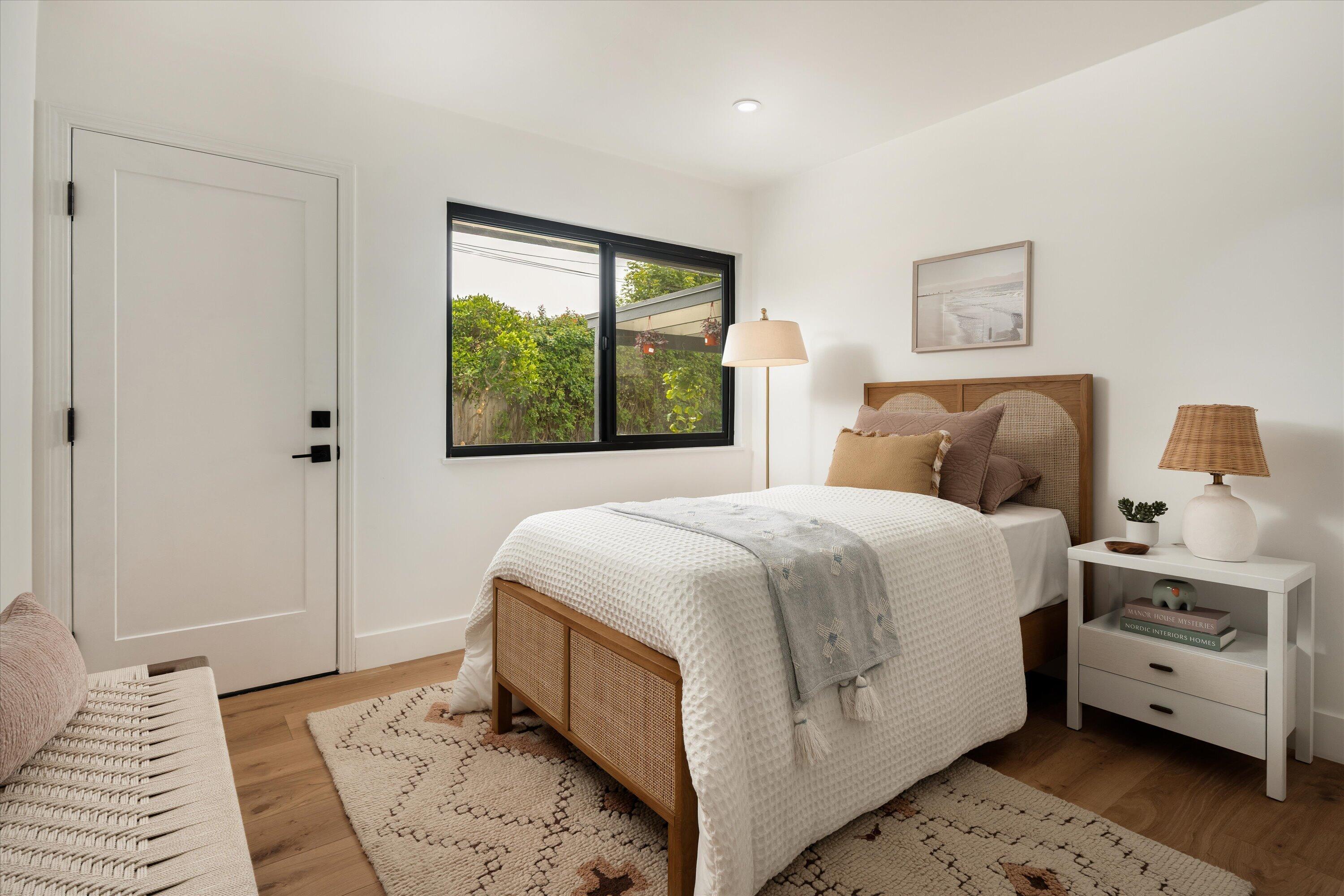 674 Burtis Street Santa Barbara, CA 93111 - Photo 17 of 29 a bedroom with a bed and a window