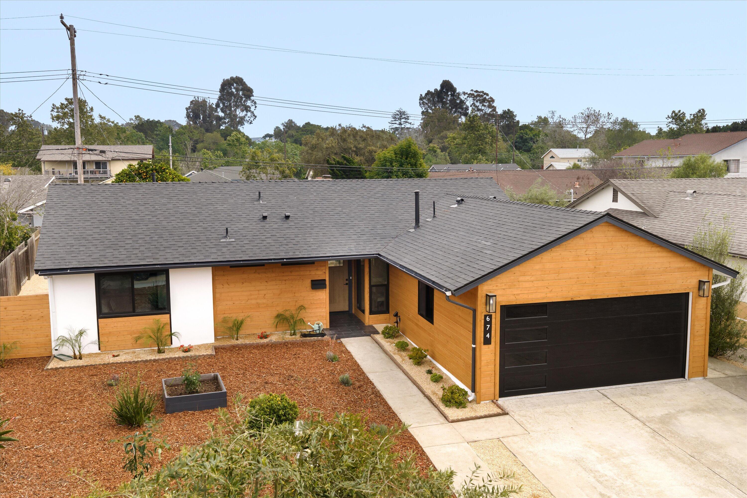 674 Burtis Street Santa Barbara, CA 93111 - Photo 25 of 29 a front view of a house with a yard