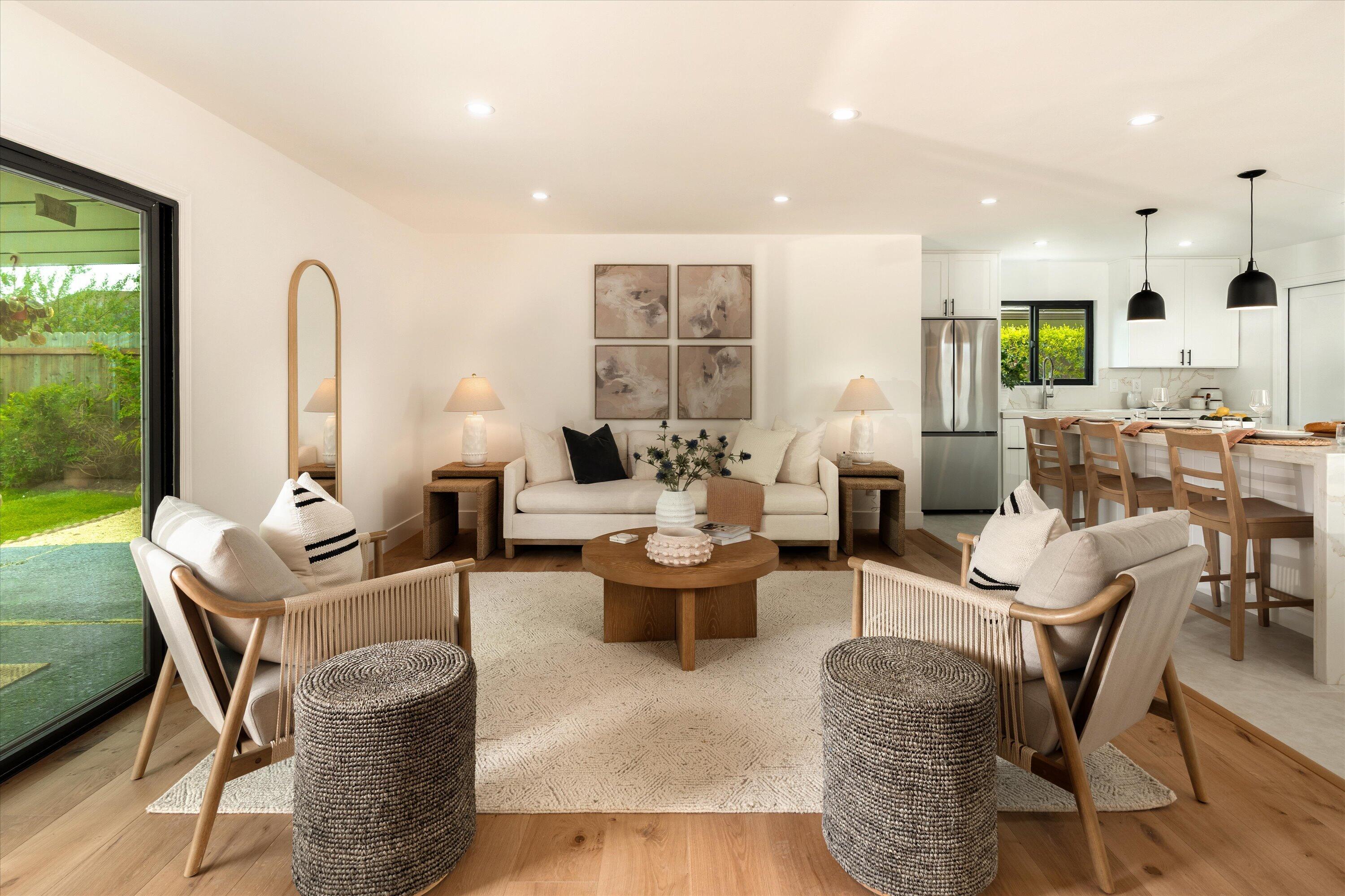 674 Burtis Street Santa Barbara, CA 93111 - Photo 5 of 29 a living room with fireplace furniture and a large window