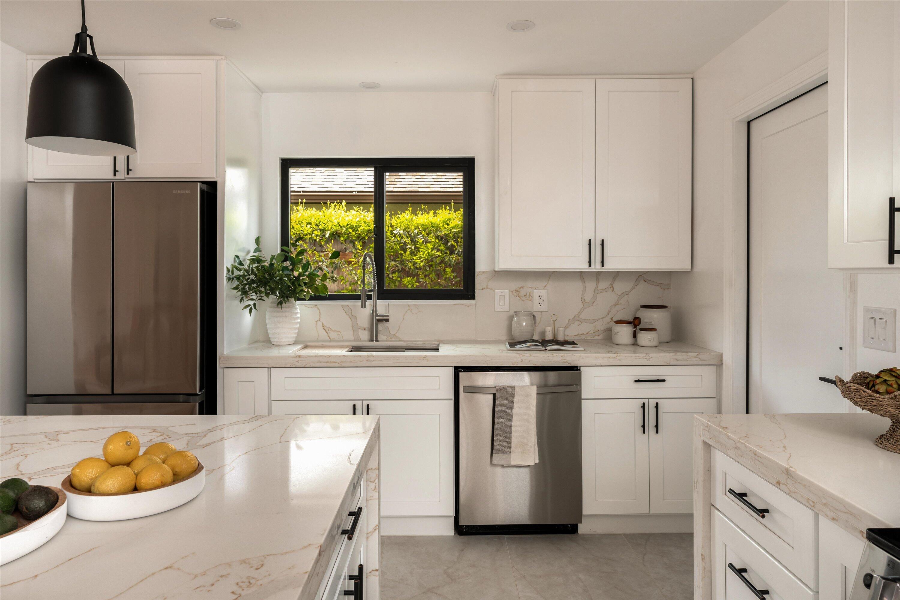 674 Burtis Street Santa Barbara, CA 93111 - Photo 9 of 29 a kitchen with stainless steel appliances a sink a stove a refrigerator and cabinets