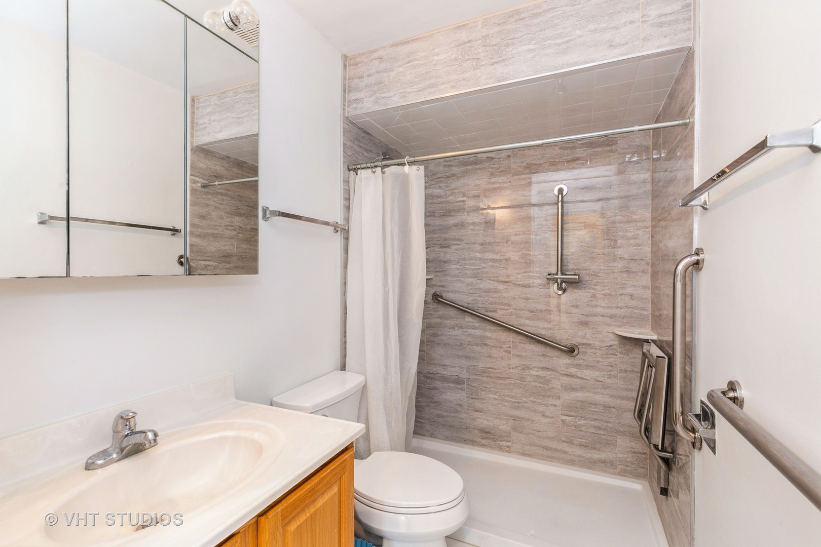 19330 Wolf Road, Unit 4 Mokena, IL 60448 - Photo 3 of 11 a bathroom with a sink toilet and shower