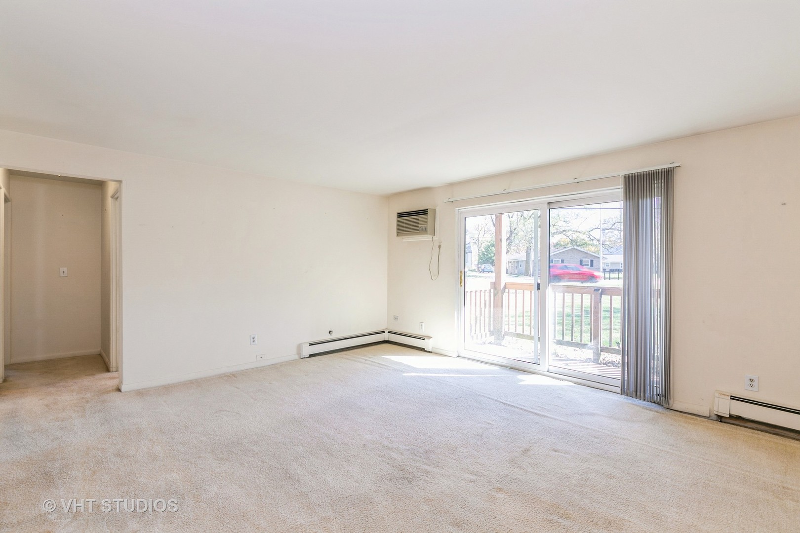 19330 Wolf Road, Unit 4 Mokena, IL 60448 - Photo 5 of 11 an empty room with floor to ceiling windows