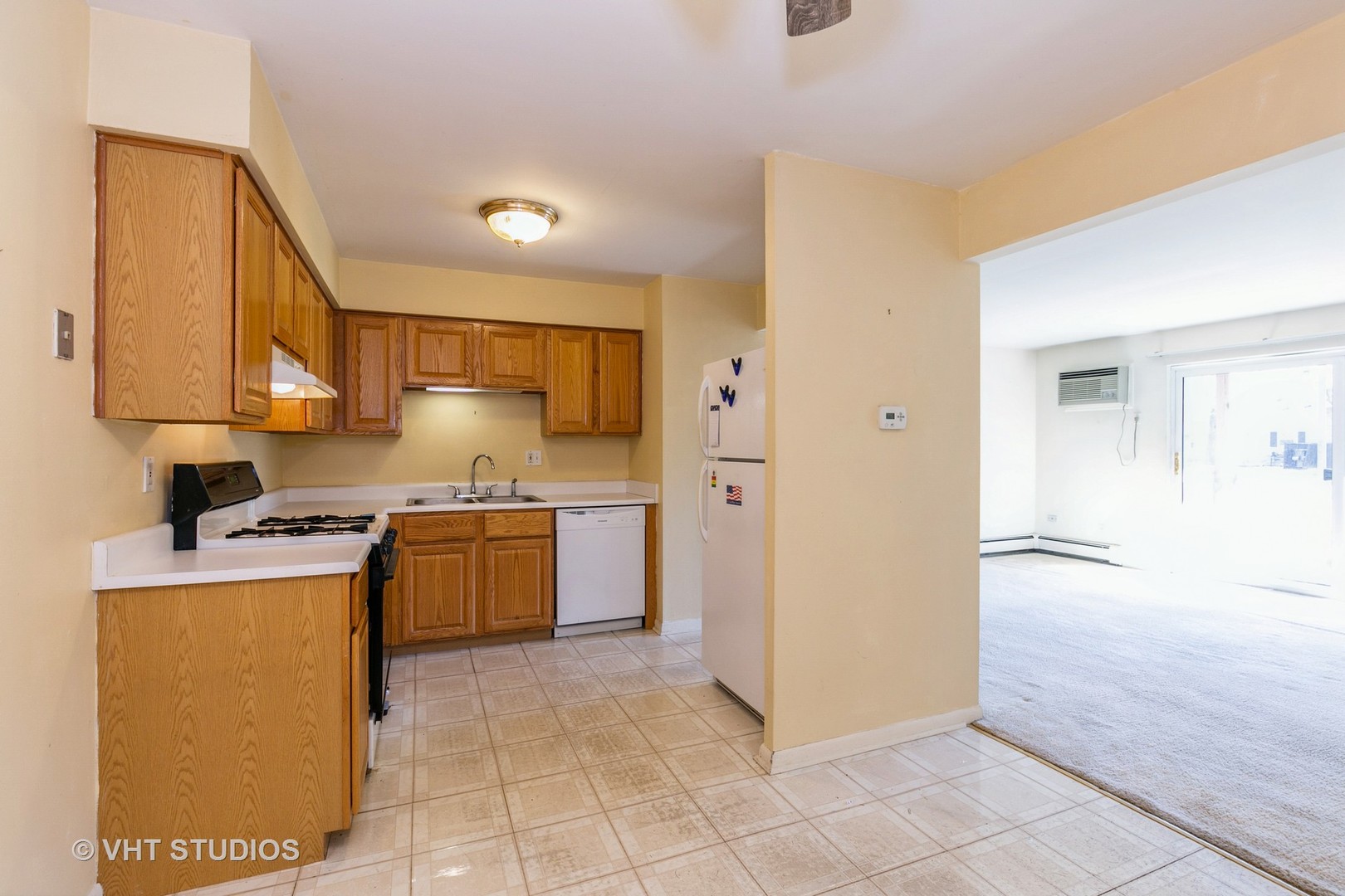 19330 Wolf Road, Unit 4 Mokena, IL 60448 - Photo 8 of 11 a kitchen with stainless steel appliances granite countertop a refrigerator and a stove