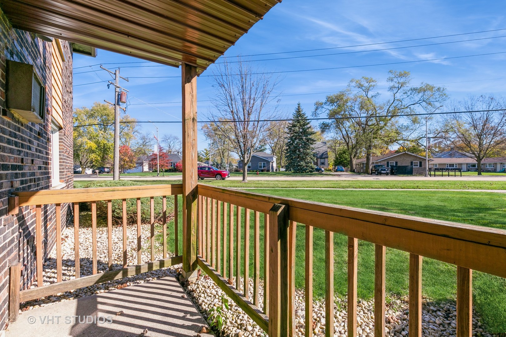 19330 Wolf Road, Unit 4 Mokena, IL 60448 - Photo 10 of 11 a view of a brick house with a big yard and potted plants