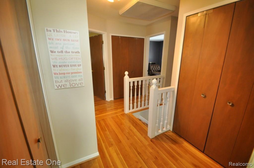 327 Shagbark Drive Rochester, MI 48309 - Photo 23 of 30 UPPER HALLWAY WITH THREE CLOSETS