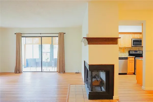 a kitchen with stainless steel appliances granite countertop a sink stove and microwave