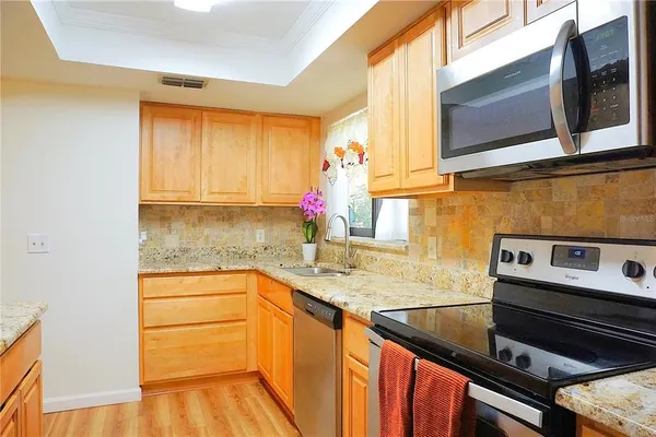 a view of a vase of flowers sitting on a table