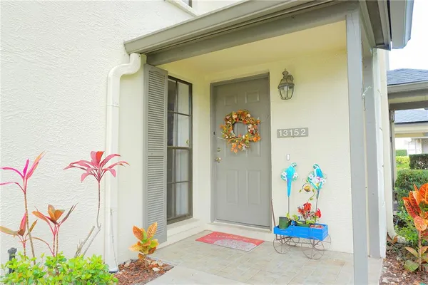 a front view of a house with an outdoor seating