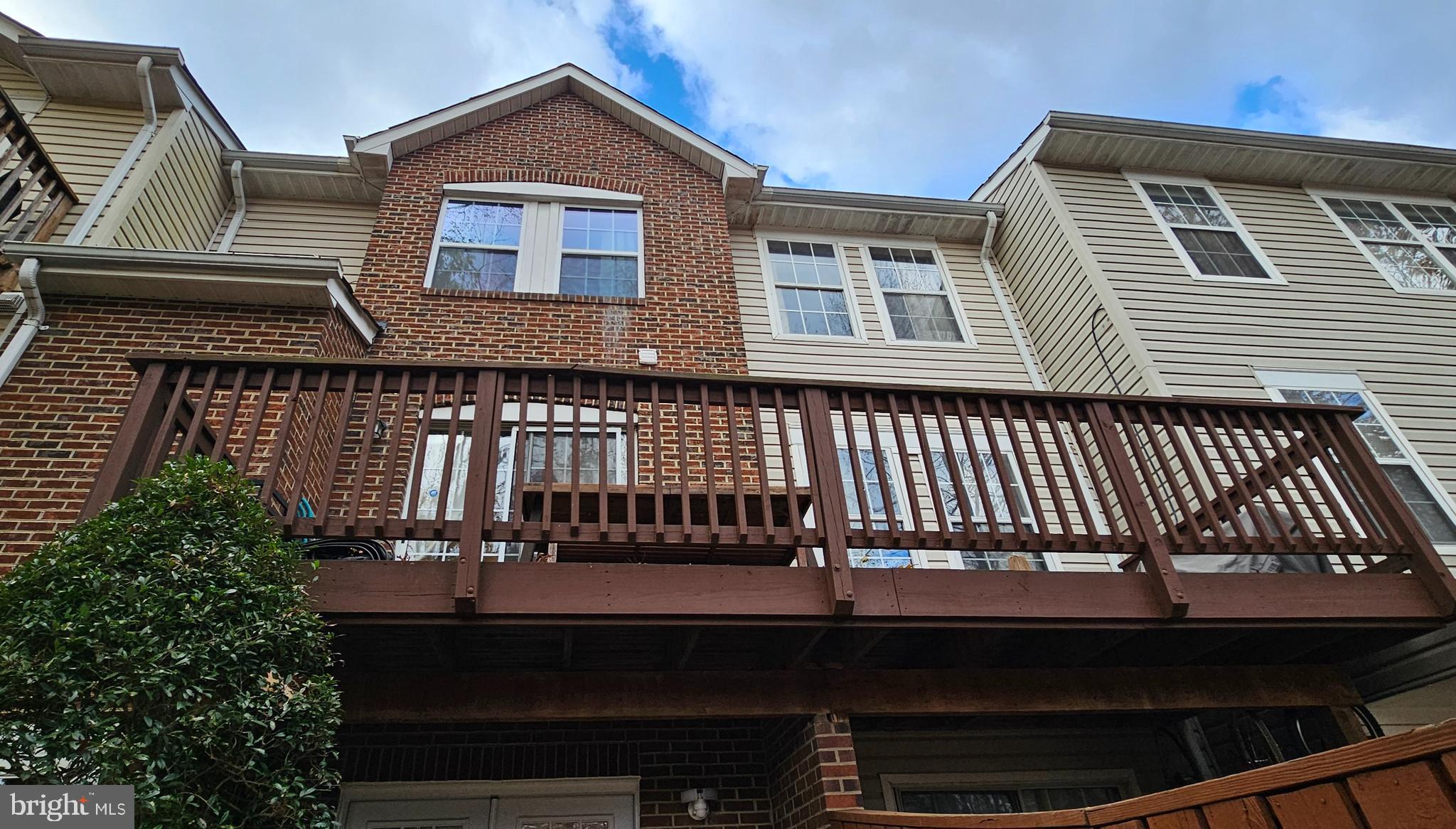 4657 Deepwood Court, Unit 106A Bowie, MD 20720 - Photo 1 of 29 a front view of a house with balcony