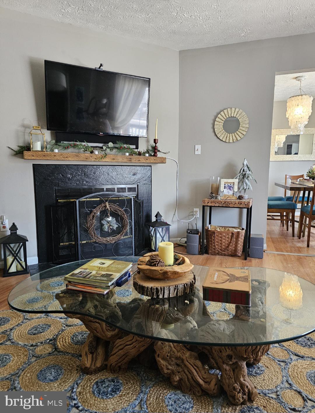 4657 Deepwood Court, Unit 106A Bowie, MD 20720 - Photo 12 of 29 a living room with furniture and a flat screen tv