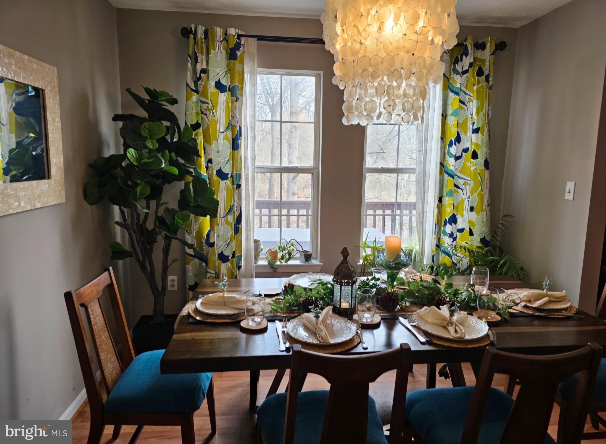 4657 Deepwood Court, Unit 106A Bowie, MD 20720 - Photo 15 of 29 a view of a dining room with furniture window and wooden floor