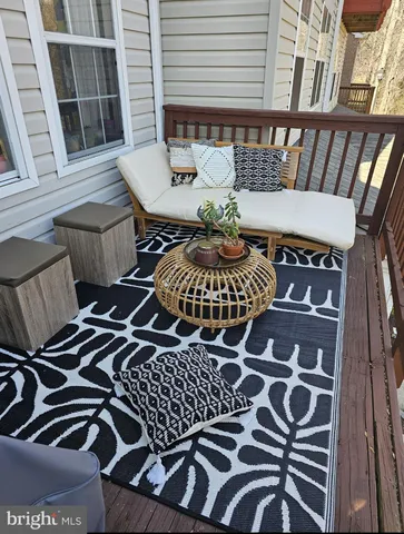 a view of balcony with wooden floor