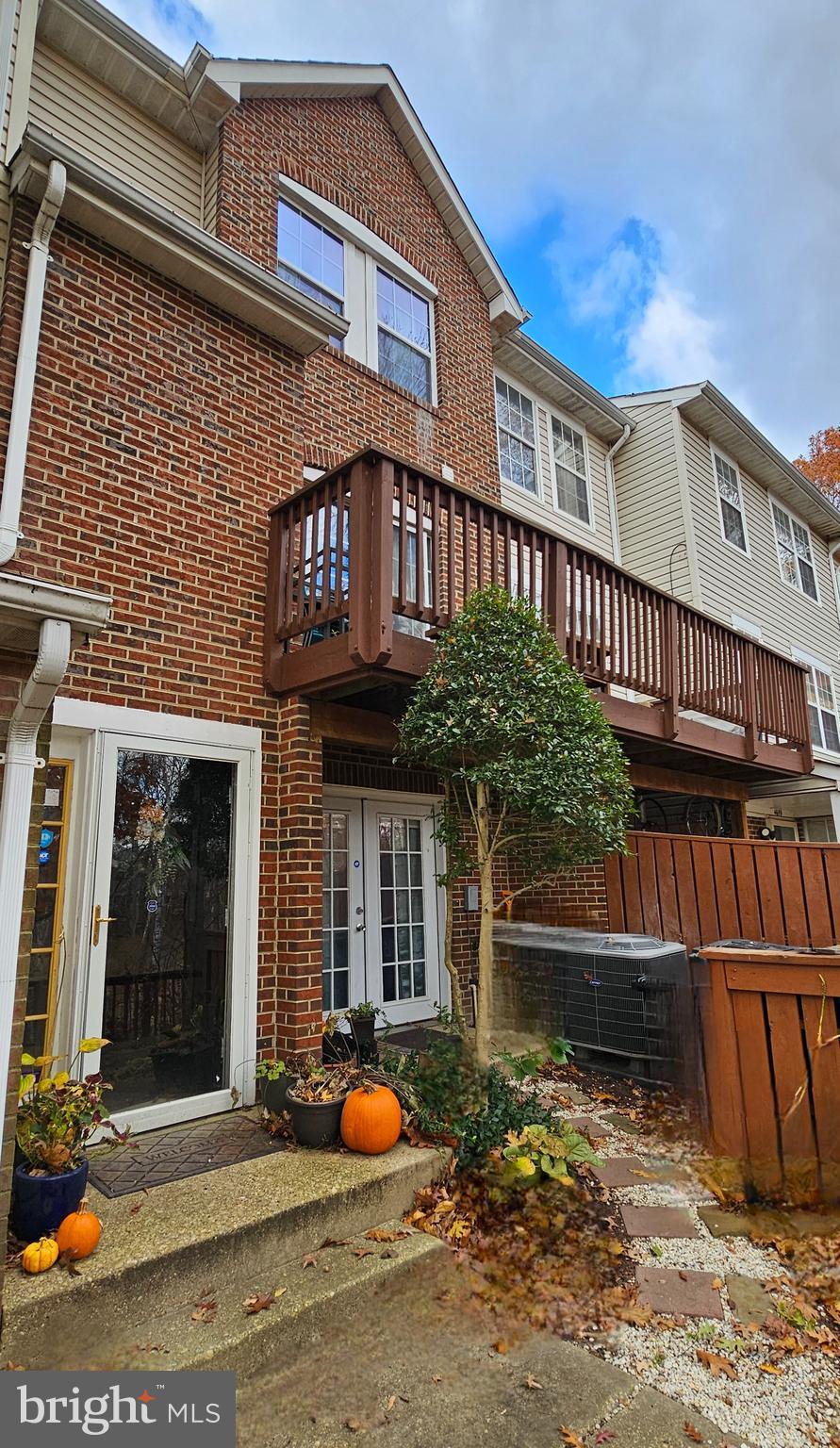 4657 Deepwood Court, Unit 106A Bowie, MD 20720 - Photo 2 of 29 a front view of a house with a yard