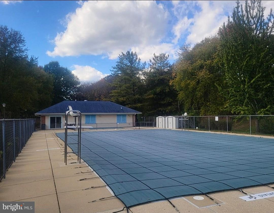 4657 Deepwood Court, Unit 106A Bowie, MD 20720 - Photo 24 of 29 a view of a house with a patio