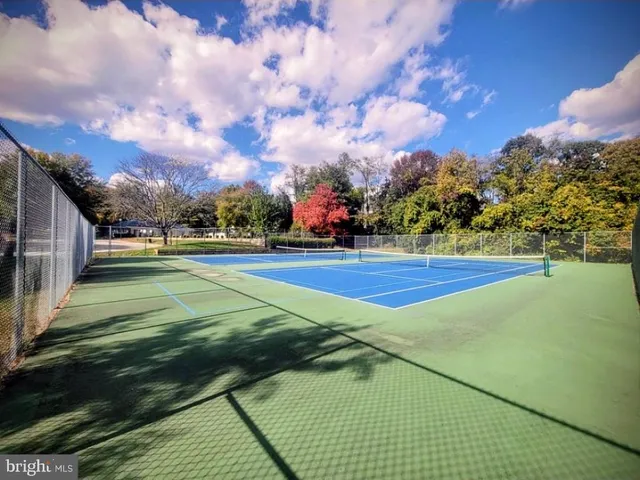a view of an outdoor space and tennis court