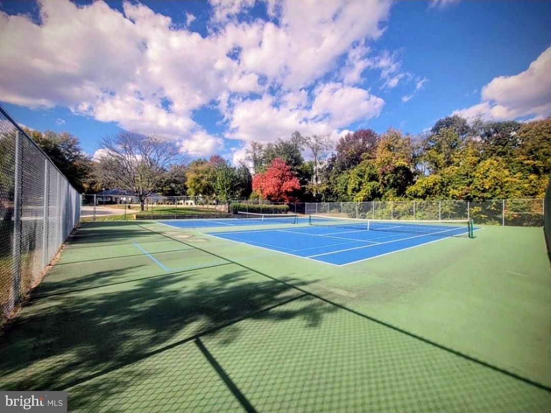 4657 Deepwood Court, Unit 106A Bowie, MD 20720 - Photo 25 of 29 a view of an outdoor space and tennis court