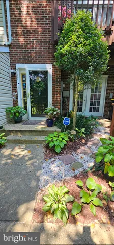 a front view of a house with a yard and a garage
