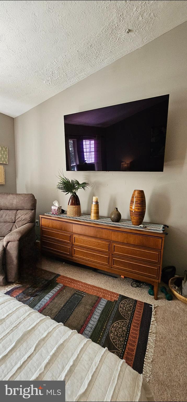 4657 Deepwood Court, Unit 106A Bowie, MD 20720 - Photo 8 of 29 a bedroom with a bed and window