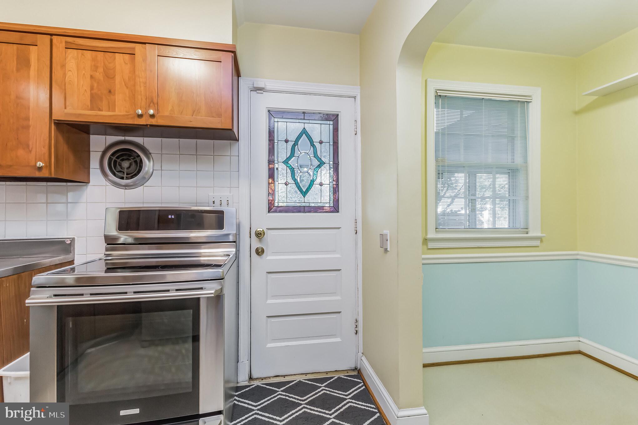 9410 Colesville Road Silver Spring, MD 20901 - Photo 11 of 38 Kitchen and breakfast nook lead to the porch