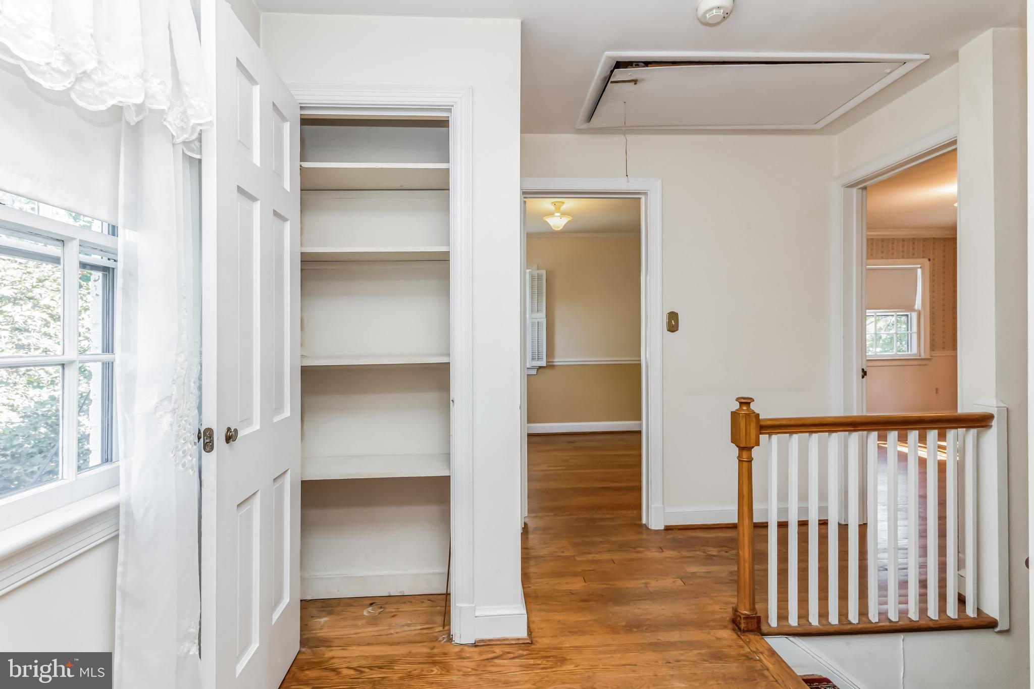 9410 Colesville Road Silver Spring, MD 20901 - Photo 14 of 38 Linen closet in hallway and attic access