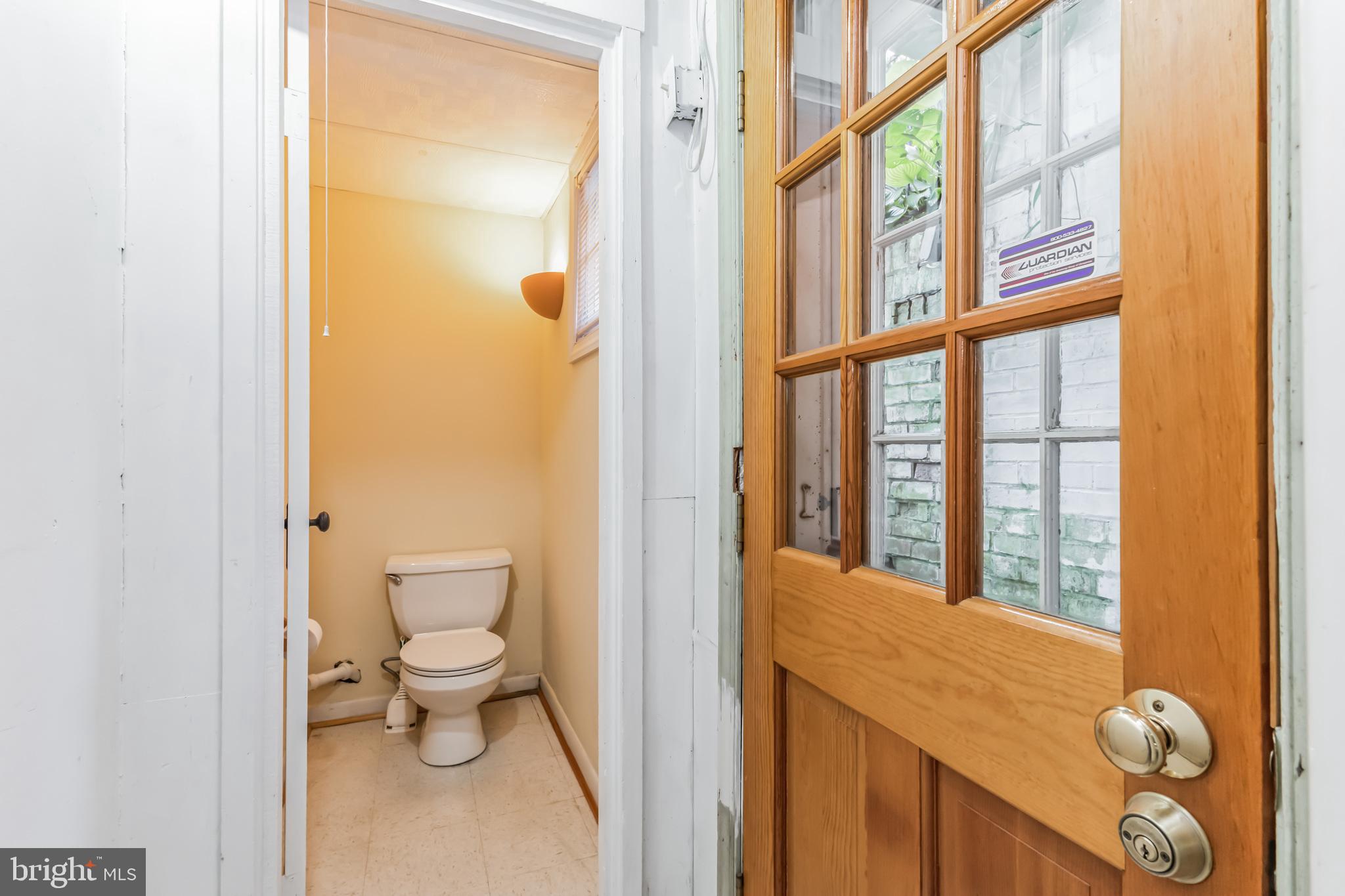 9410 Colesville Road Silver Spring, MD 20901 - Photo 26 of 38 Commode closet and exit to back yard