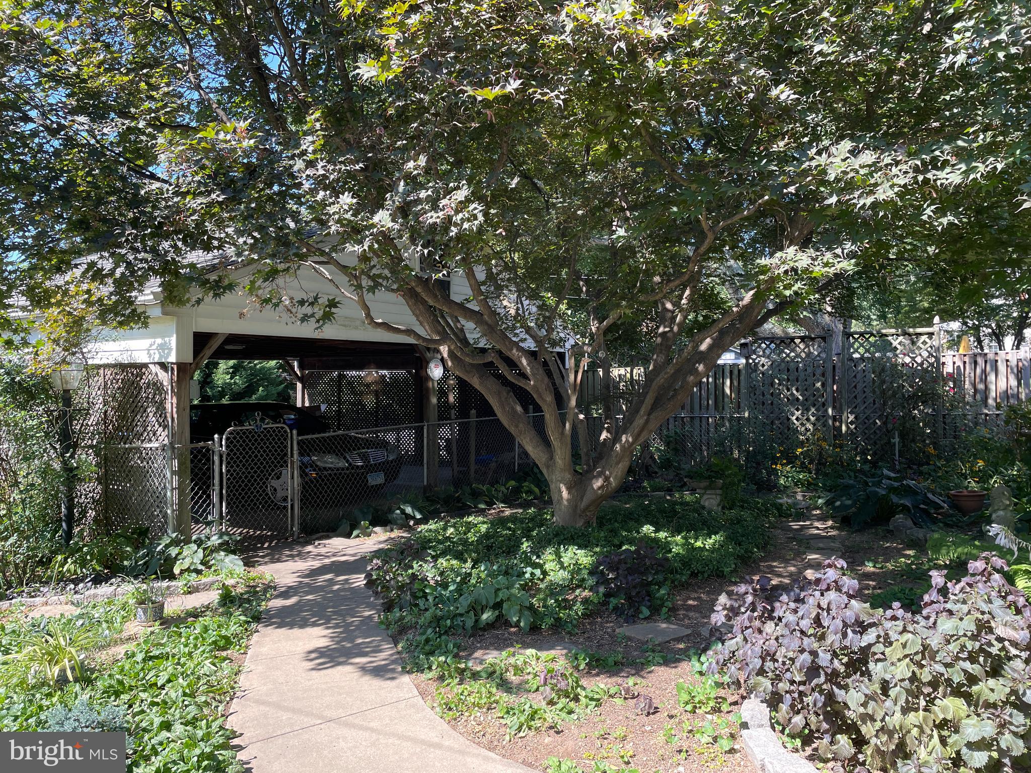 9410 Colesville Road Silver Spring, MD 20901 - Photo 32 of 38 Fenced backyard showing carport