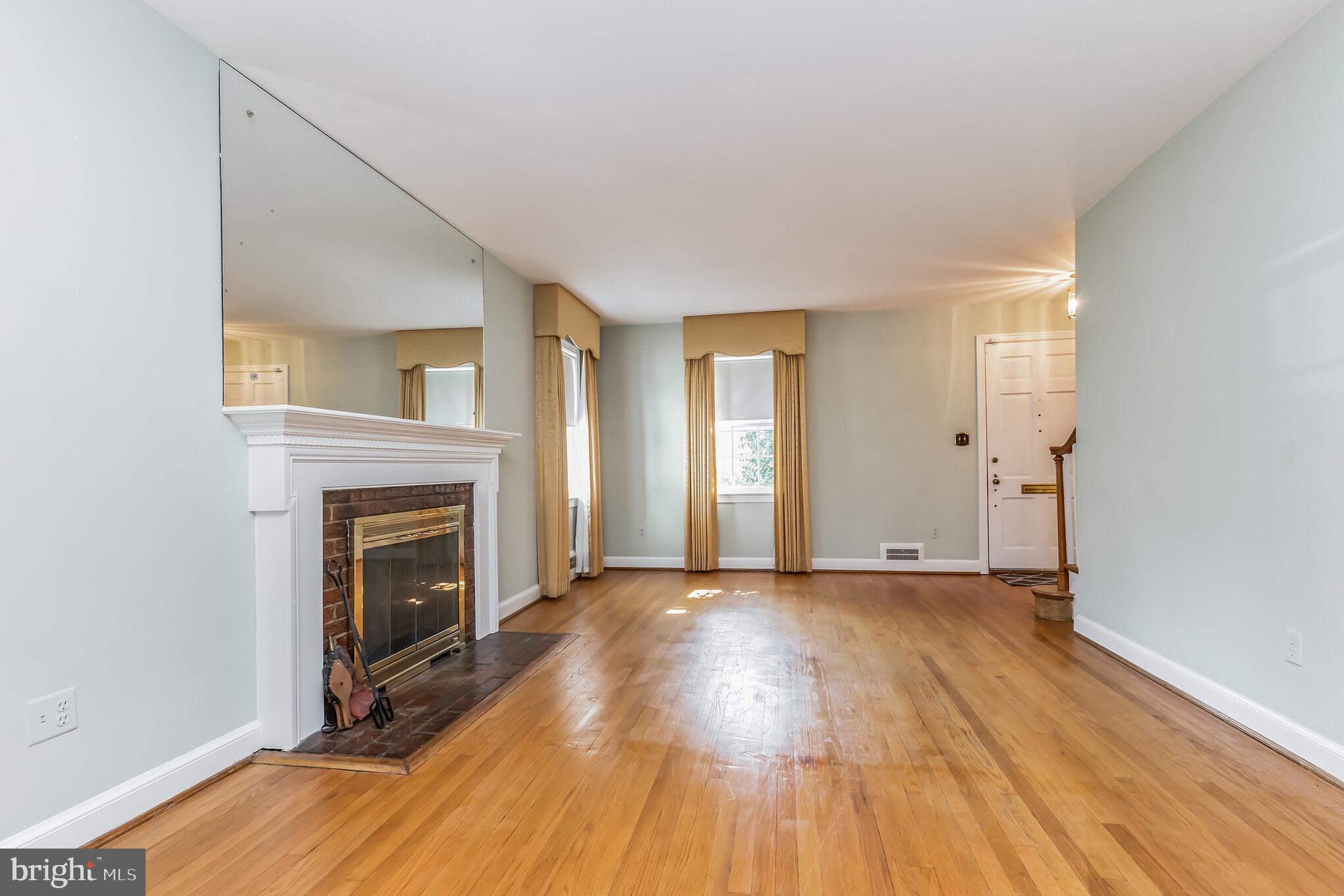 9410 Colesville Road Silver Spring, MD 20901 - Photo 5 of 38 Living room with wood burning fireplace