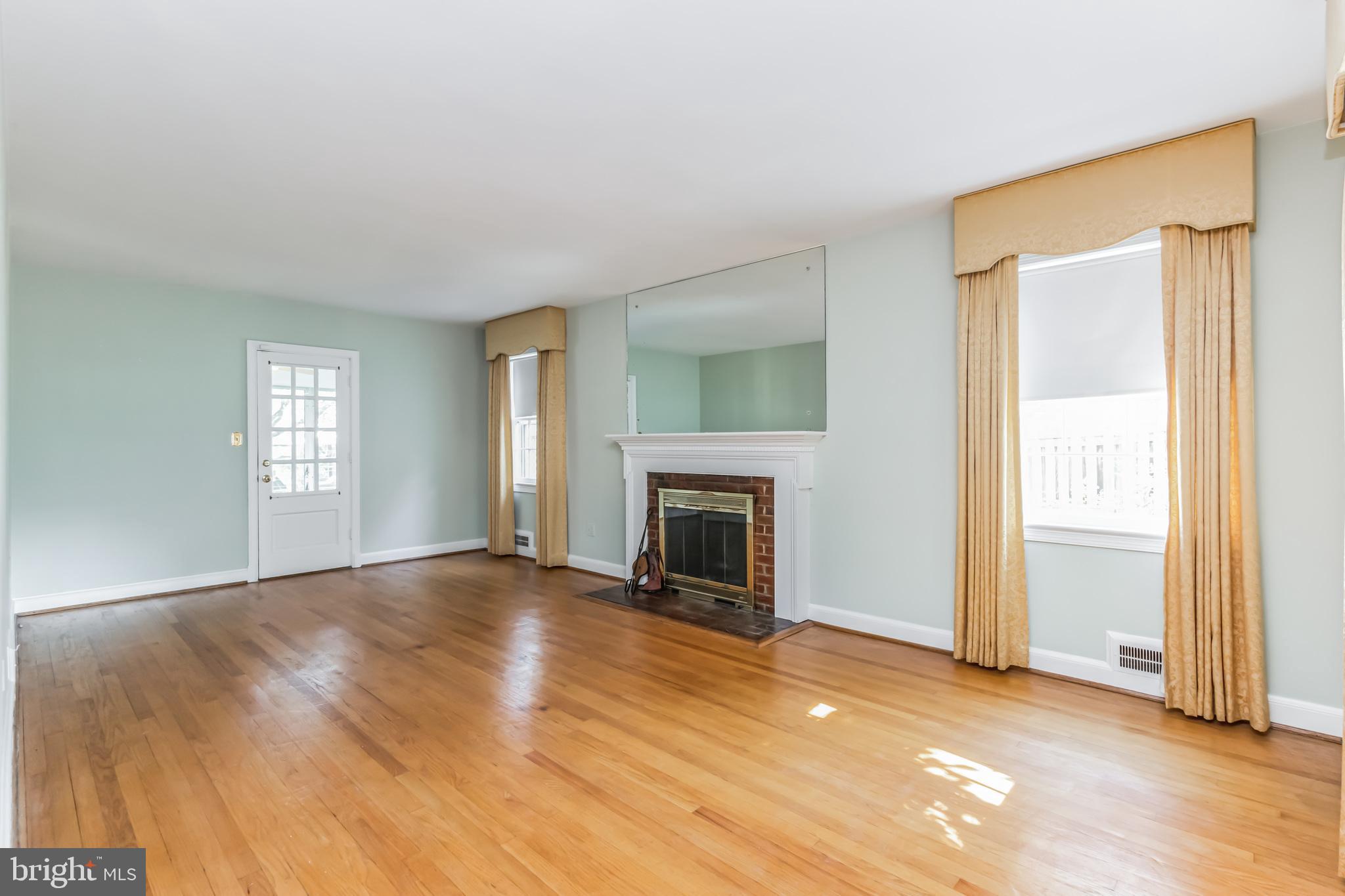 9410 Colesville Road Silver Spring, MD 20901 - Photo 6 of 38 Living room leads to the sun porch
