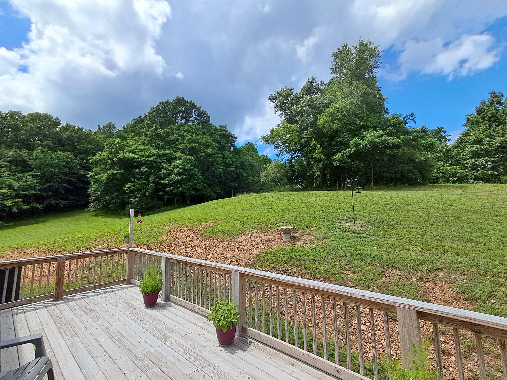 5525 Wiley Hollow Road Culleoka, TN 38451 - Photo 62 of 64 a view of a wooden deck with a yard