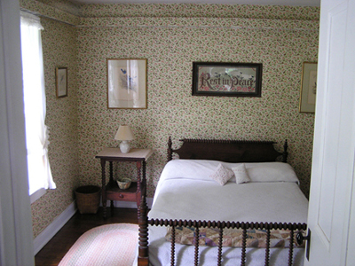 566 Main Road Monterey, MA 01245 - Photo 14 of 31 a bedroom with a bed and a table in it