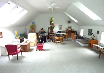 566 Main Road Monterey, MA 01245 - Photo 22 of 31 a living room with furniture and a chandelier
